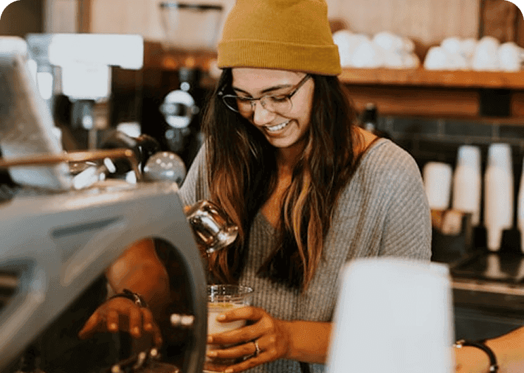 Service worker pouring coffee